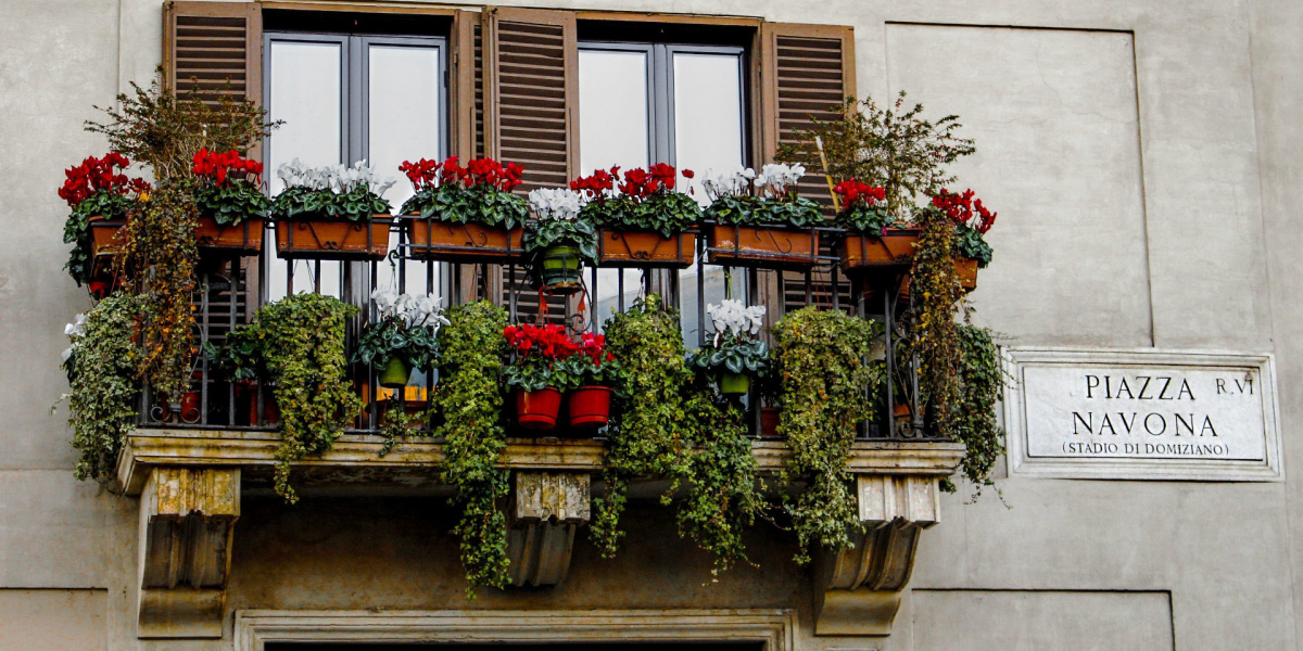 balcony with flowers in piazza navona in rome