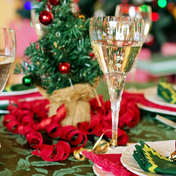 table with dishes, glasses and christmas decoration