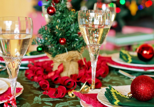 table with dishes, glasses and christmas decoration