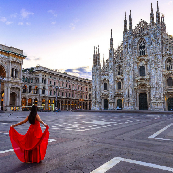 milan cathedral and a lady with a red dress