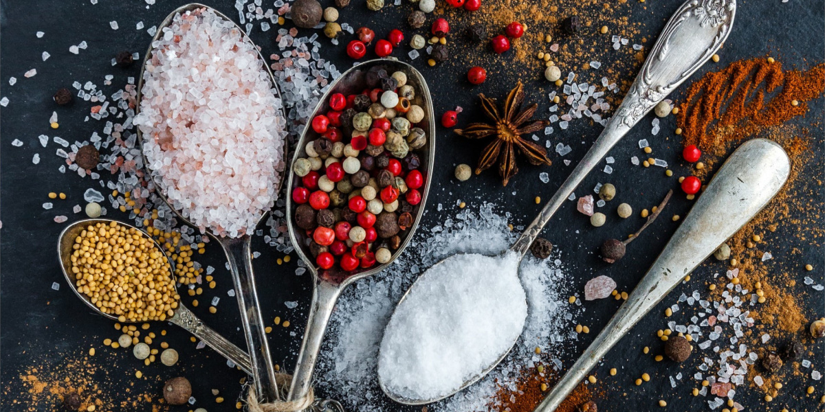 salt pepper spieces and a spoon