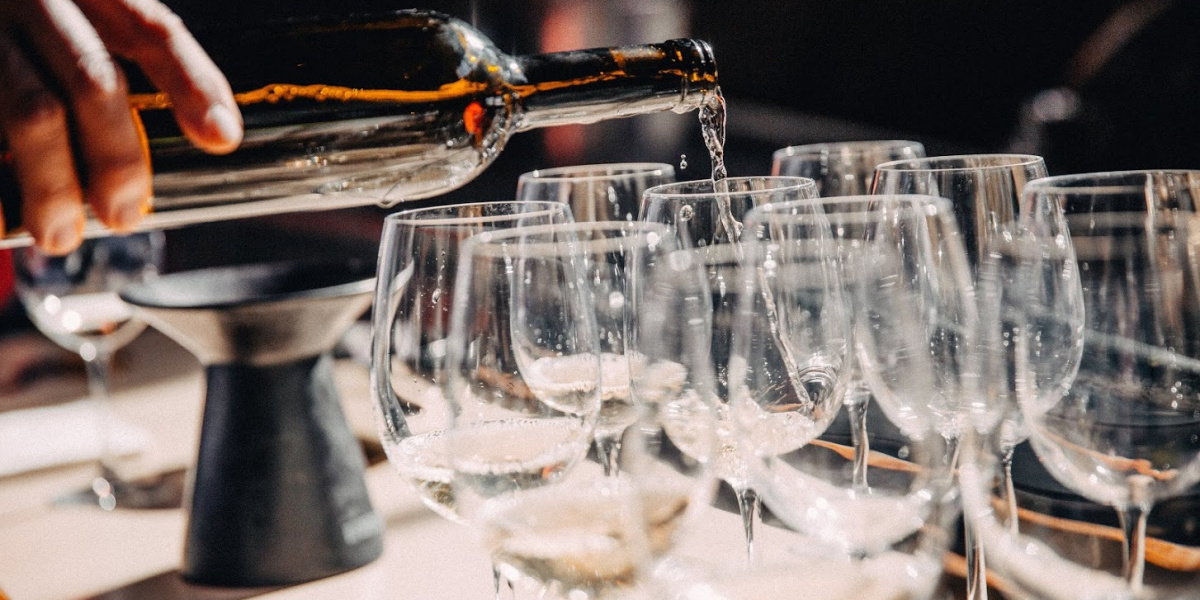 Bottle of wine poured in glasses